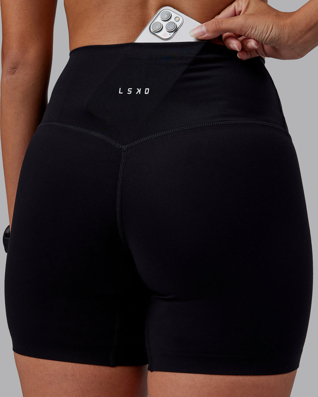 Woman wearing Elixir High-Rise 6&quot; Short - Black | Model:Rhiley | Size:S