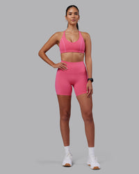 Woman wearing Elixir High-Rise 6" Short - Hot Pink | Model:Rhiley | Size:S
