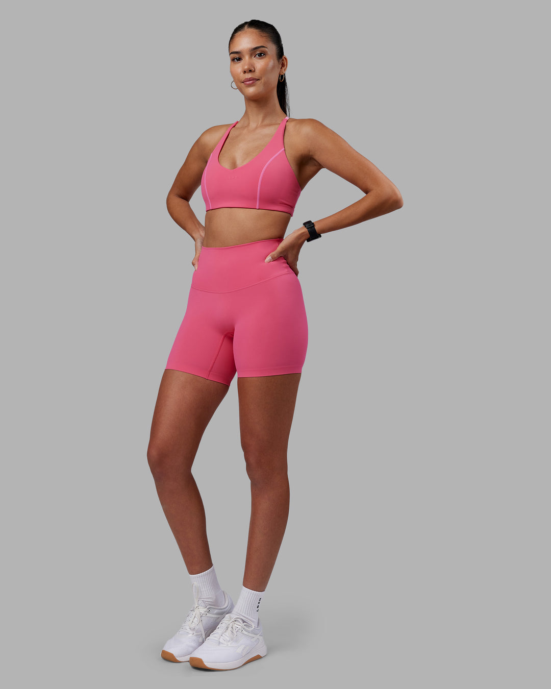 Woman wearing Elixir High-Rise 6&quot; Short - Hot Pink | Model:Rhiley | Size:S