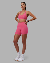 Woman wearing Elixir High-Rise 6" Short - Hot Pink | Model:Rhiley | Size:S