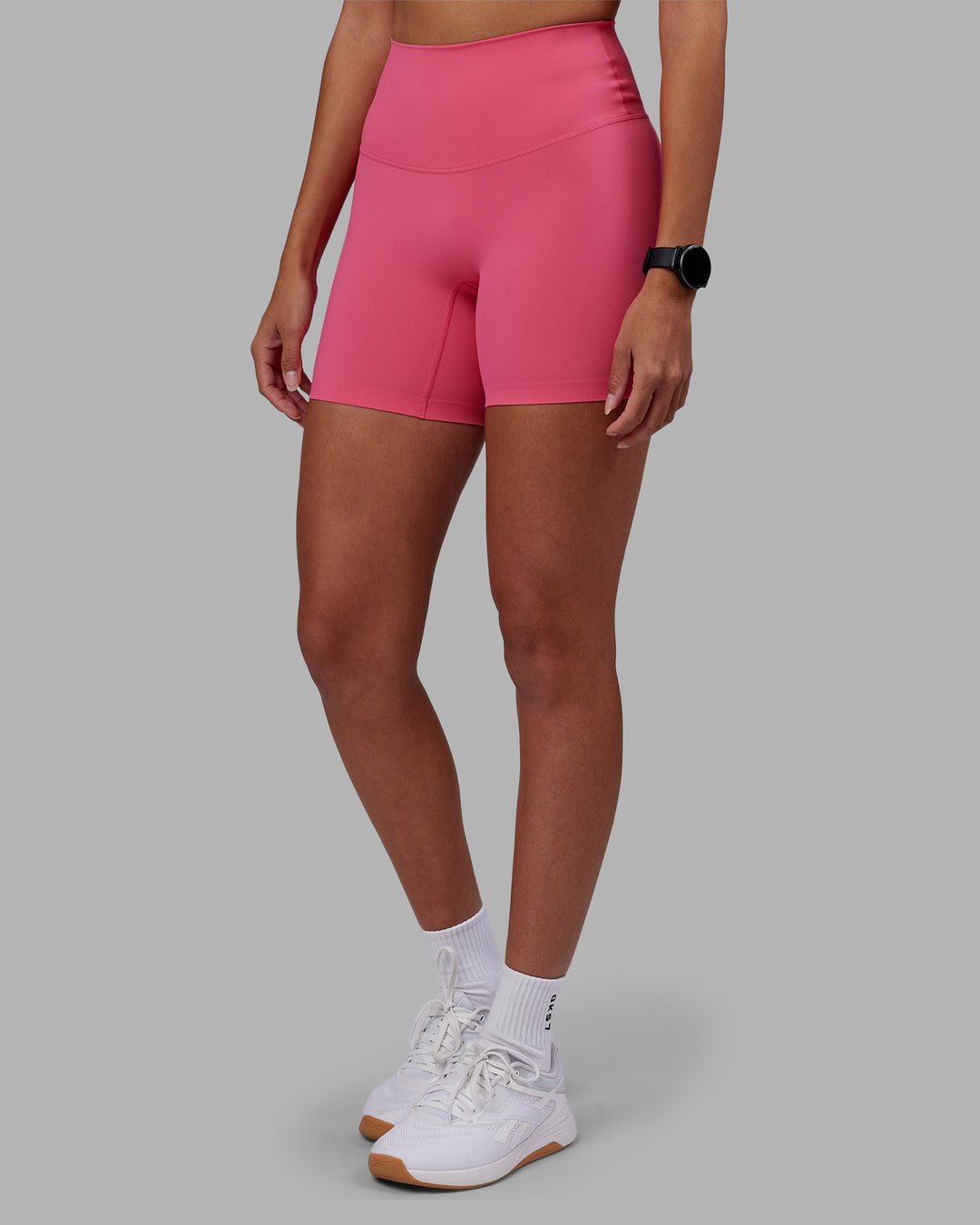 Woman wearing Elixir High-Rise 6&quot; Short - Hot Pink | Model:Rhiley | Size:S