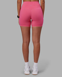Woman wearing Elixir High-Rise 6" Short - Hot Pink | Model:Rhiley | Size:S