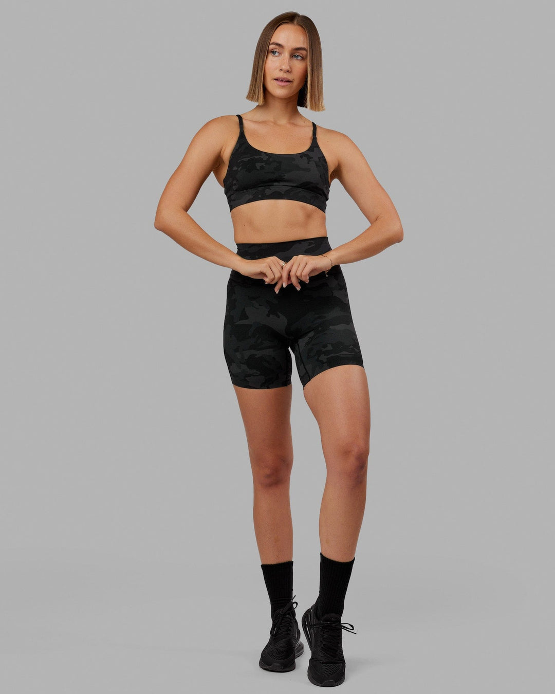 Woman wearing Elixir Ultra High-Rise 6&quot; Short - Black Camo  | Model:Chelsea | Size:S