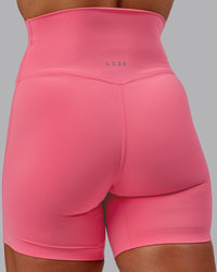 Woman wearing Elixir Ultra High-Rise 6" Short - Pink Lemonade | Size:S