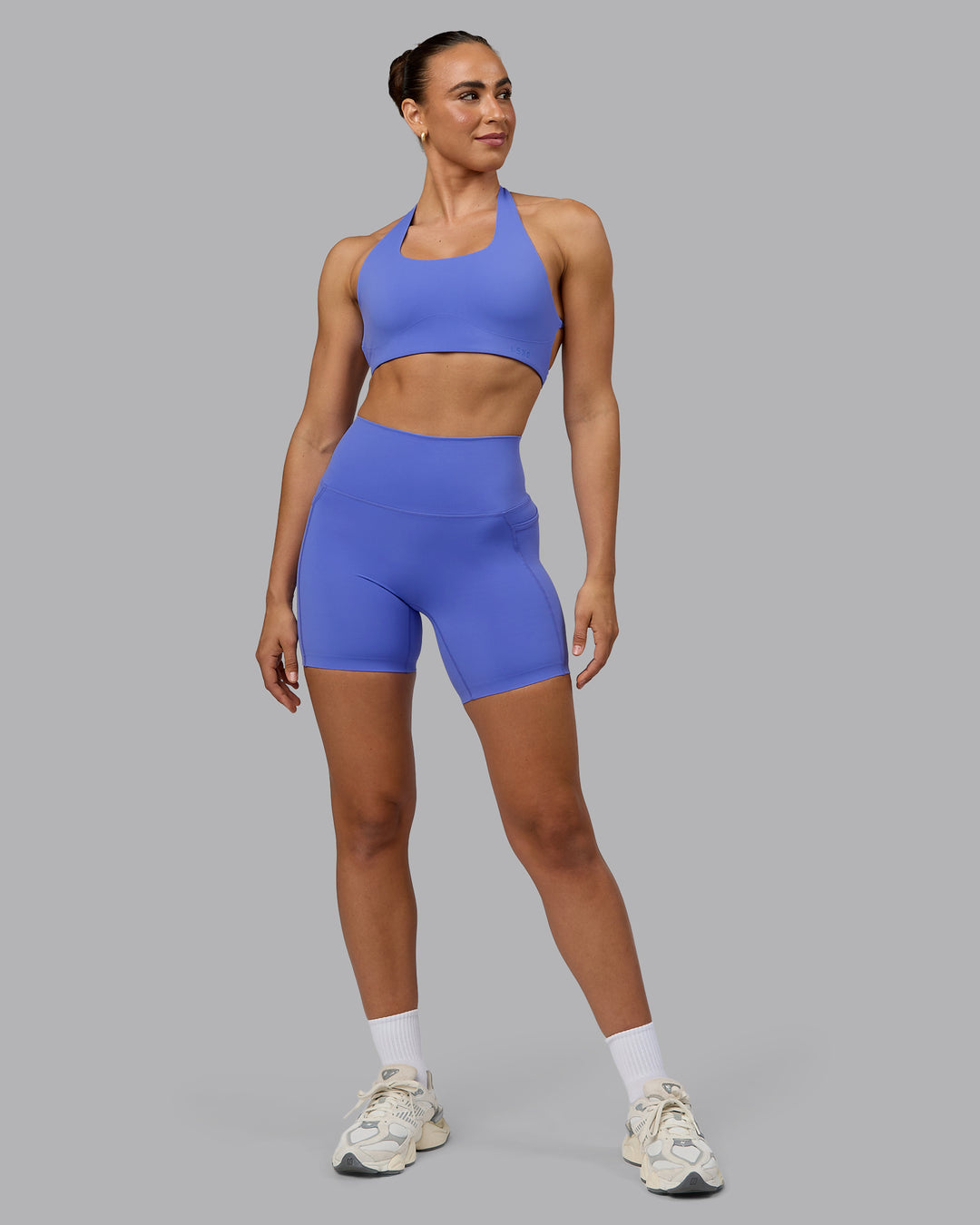 Woman wearing Elixir Ultra High-Rise 6&quot; Short Pockets - Baja Blue
