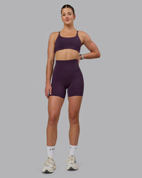 Woman wearing Elixir Ultra High-Rise 6" Short Pockets - Midnight Plum