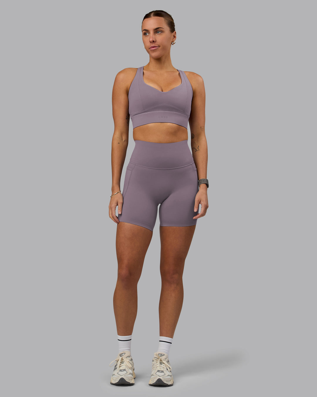 Woman wearing Elixir Ultra High-Rise 6&quot; Short Pockets - Purple Sage