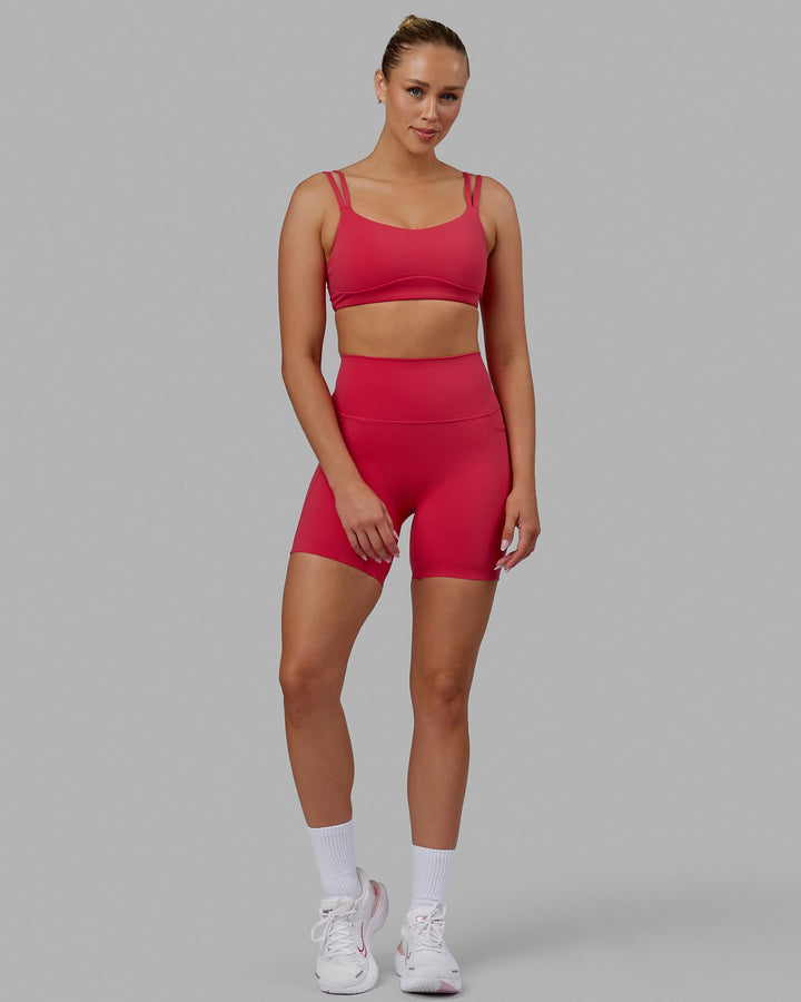 Woman wearing Elixir Mid Short Tights with Pockets - Raspberry