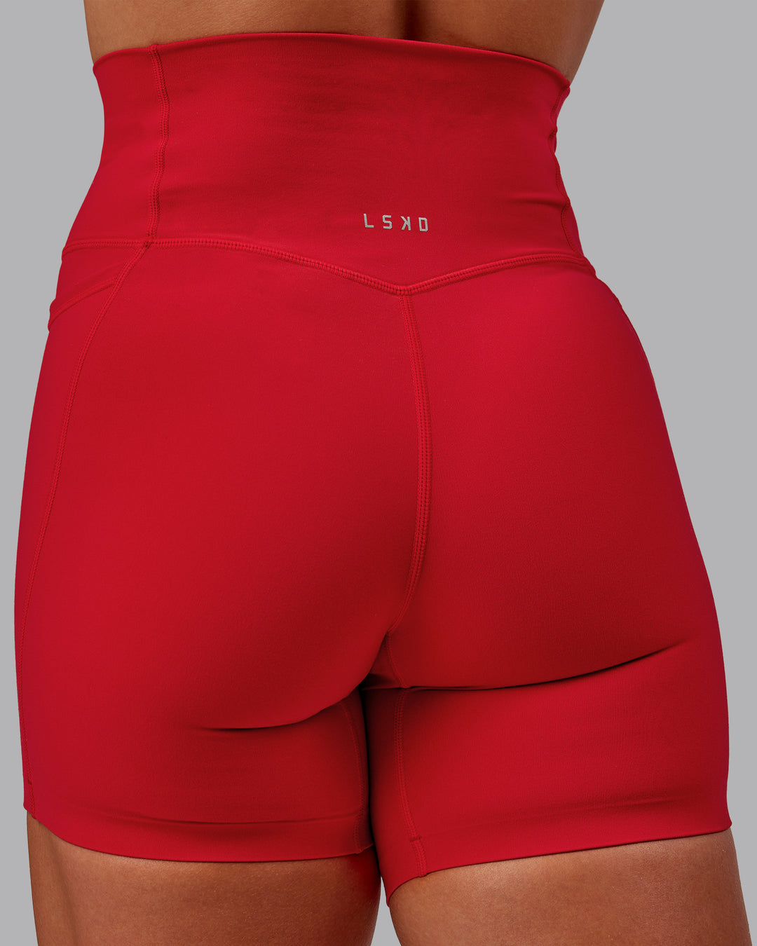 Woman wearing Elixir Ultra High-Rise 6&quot; Short Pockets - Flame | Size:S