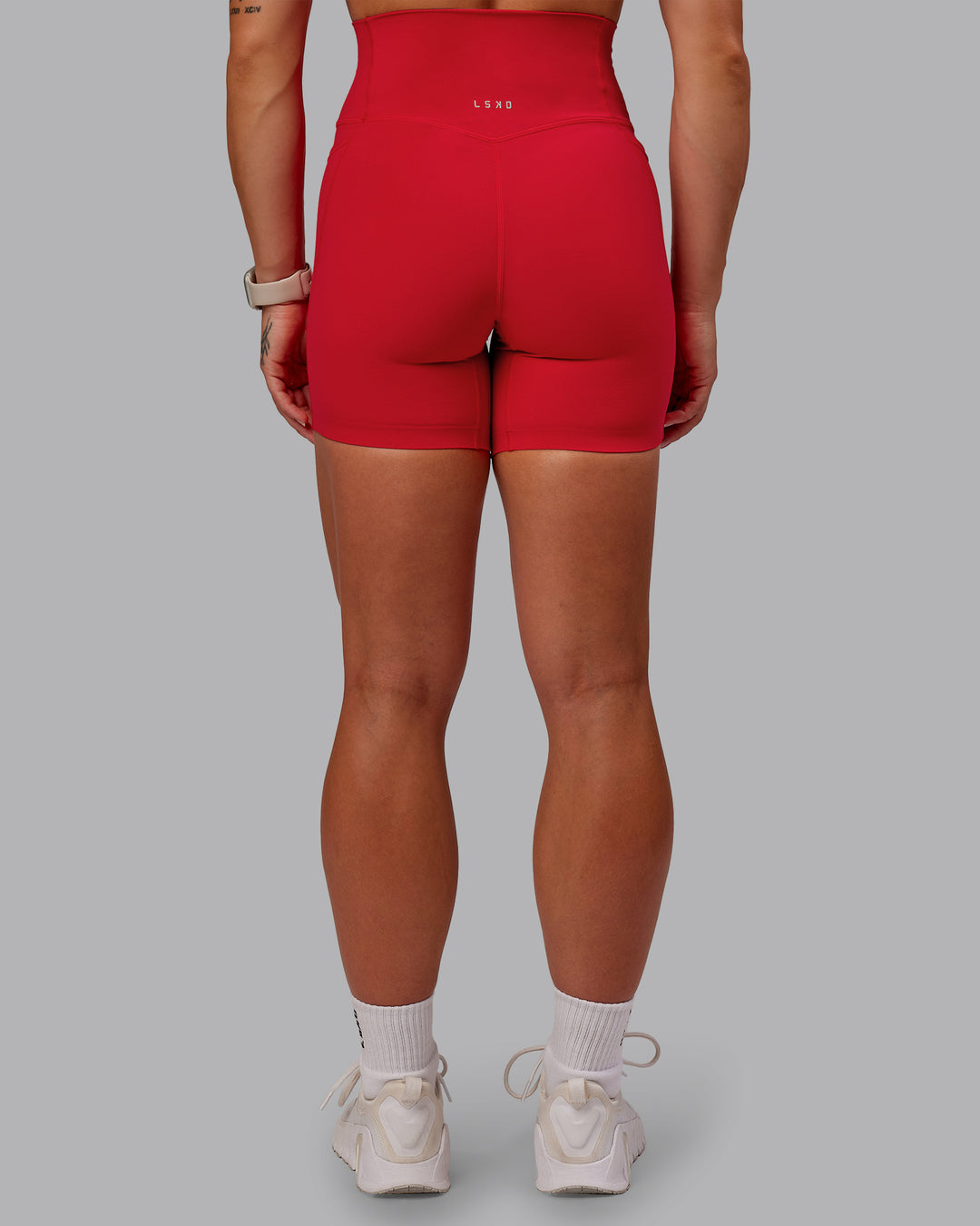 Woman wearing Elixir Ultra High-Rise 6&quot; Short Pockets - Flame | Size:S