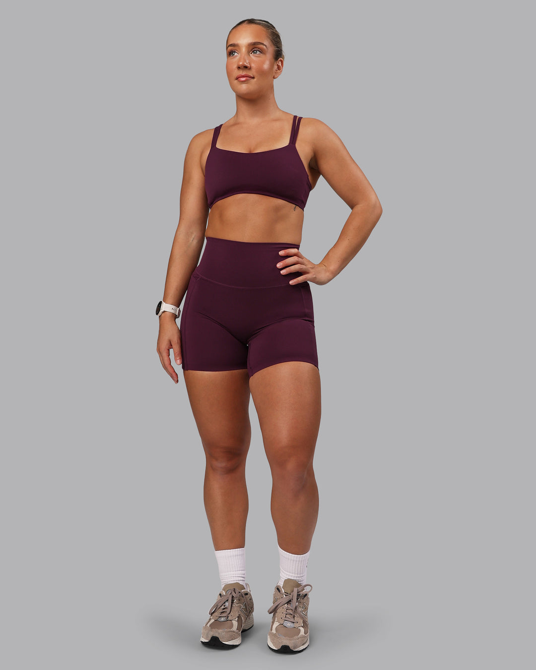 Woman wearing Elixir Ultra High-Rise 6" Short Pockets - Cherry Lacquer