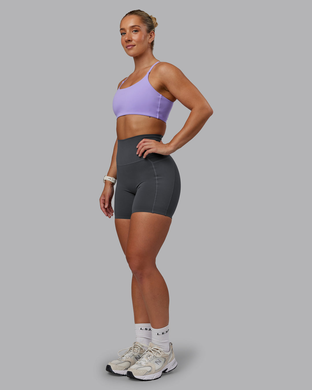 Woman wearing Elixir Ultra High-Rise 6" Short Pockets - Dark Storm | Size:S