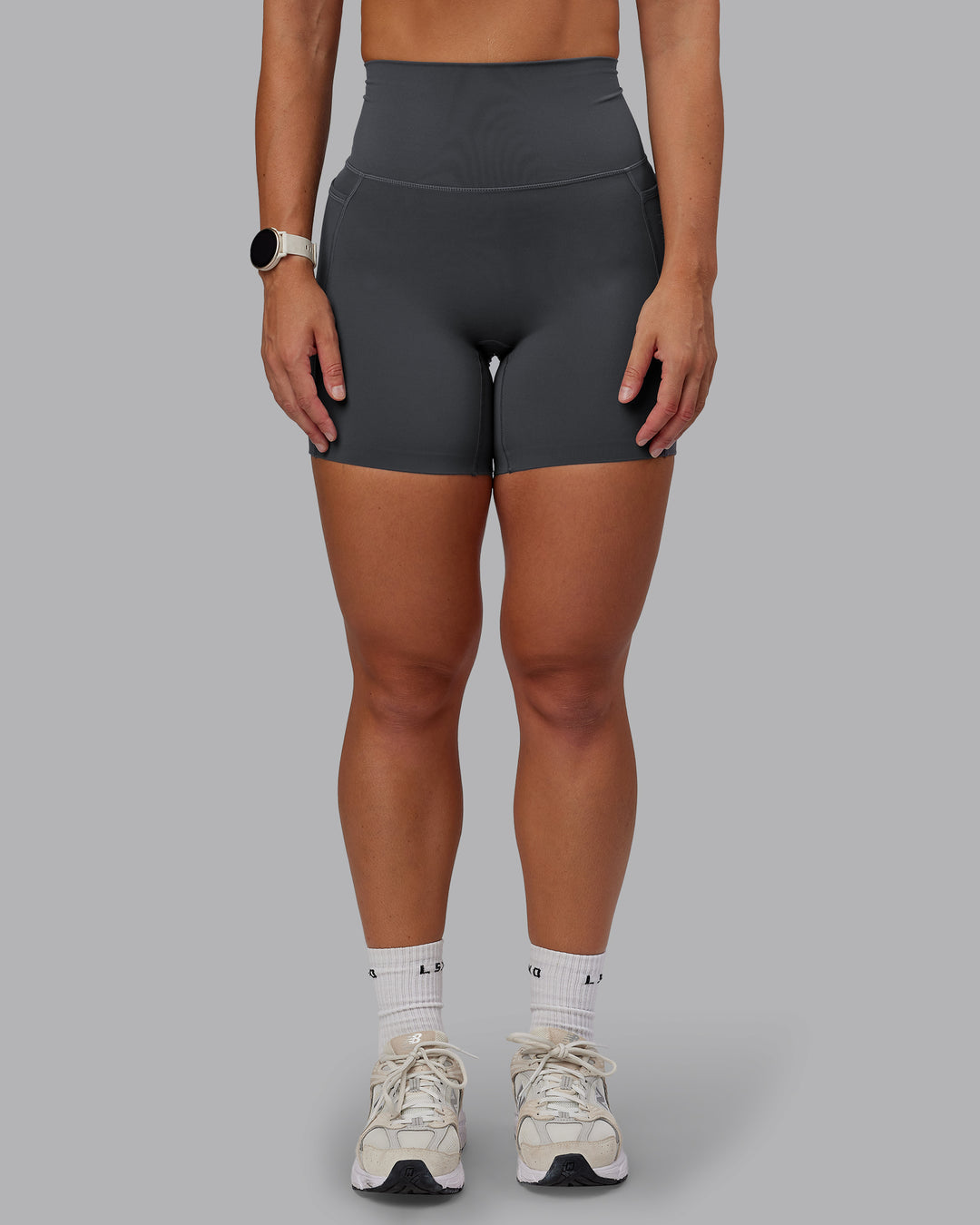 Woman wearing Elixir Ultra High-Rise 6" Short Pockets - Dark Storm | Size:S