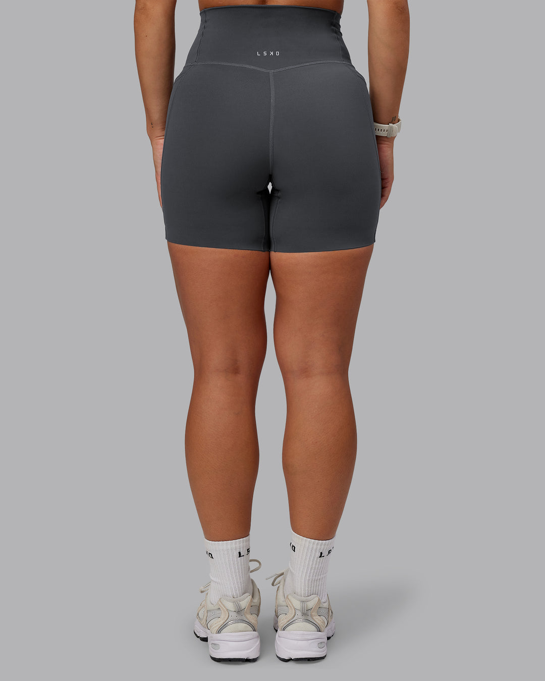 Woman wearing Elixir Ultra High-Rise 6" Short Pockets - Dark Storm | Size:S