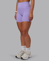 Woman wearing Elixir Ultra High-Rise 6" Short Pockets - Violet Ray | Size:S