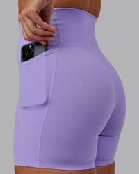 Woman wearing Elixir Ultra High-Rise 6" Short Pockets - Violet Ray | Size:S
