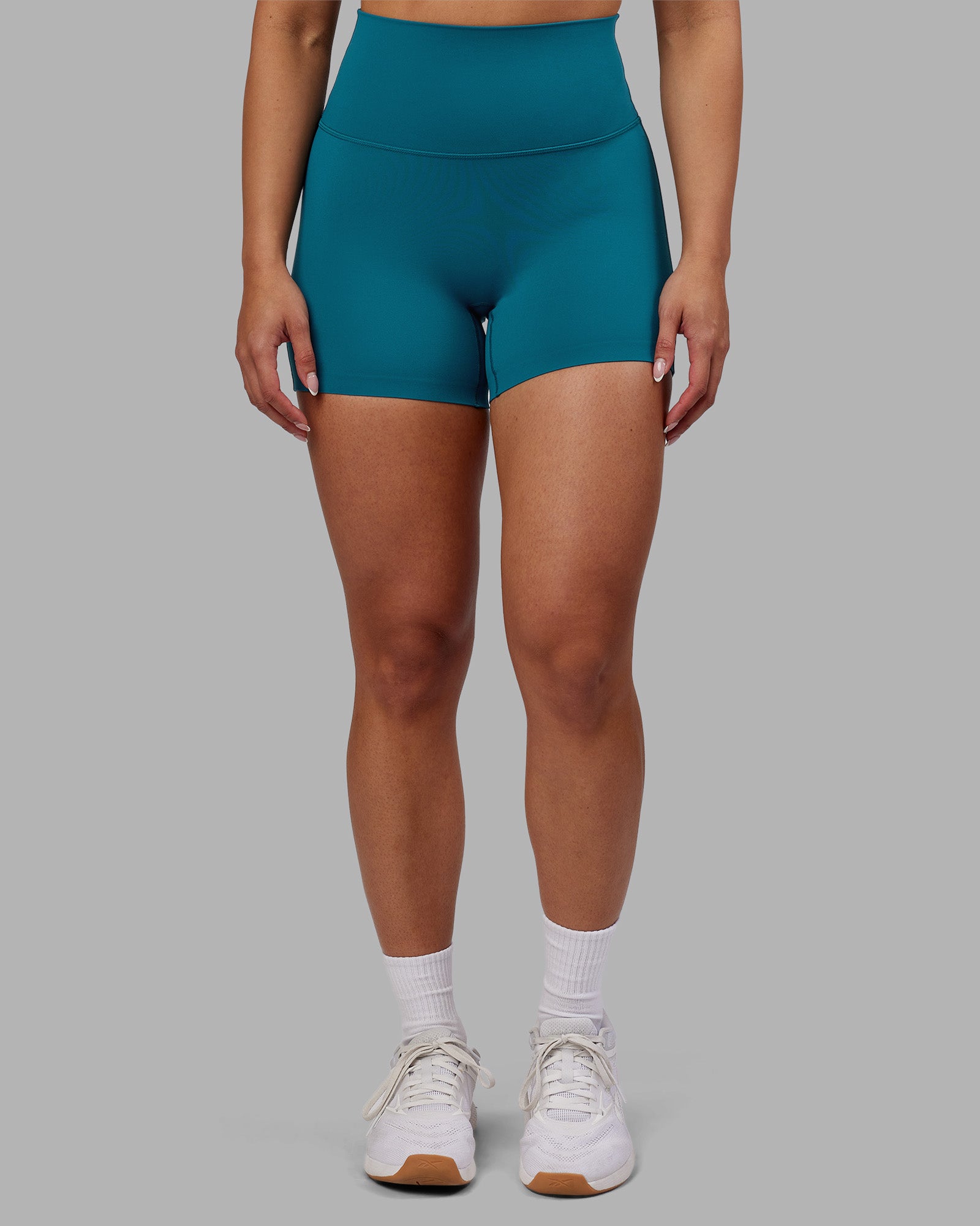 Woman wearing Elixir Ultra High-Rise 4" Short - Blue Coral | Model:Ayla | Size:S