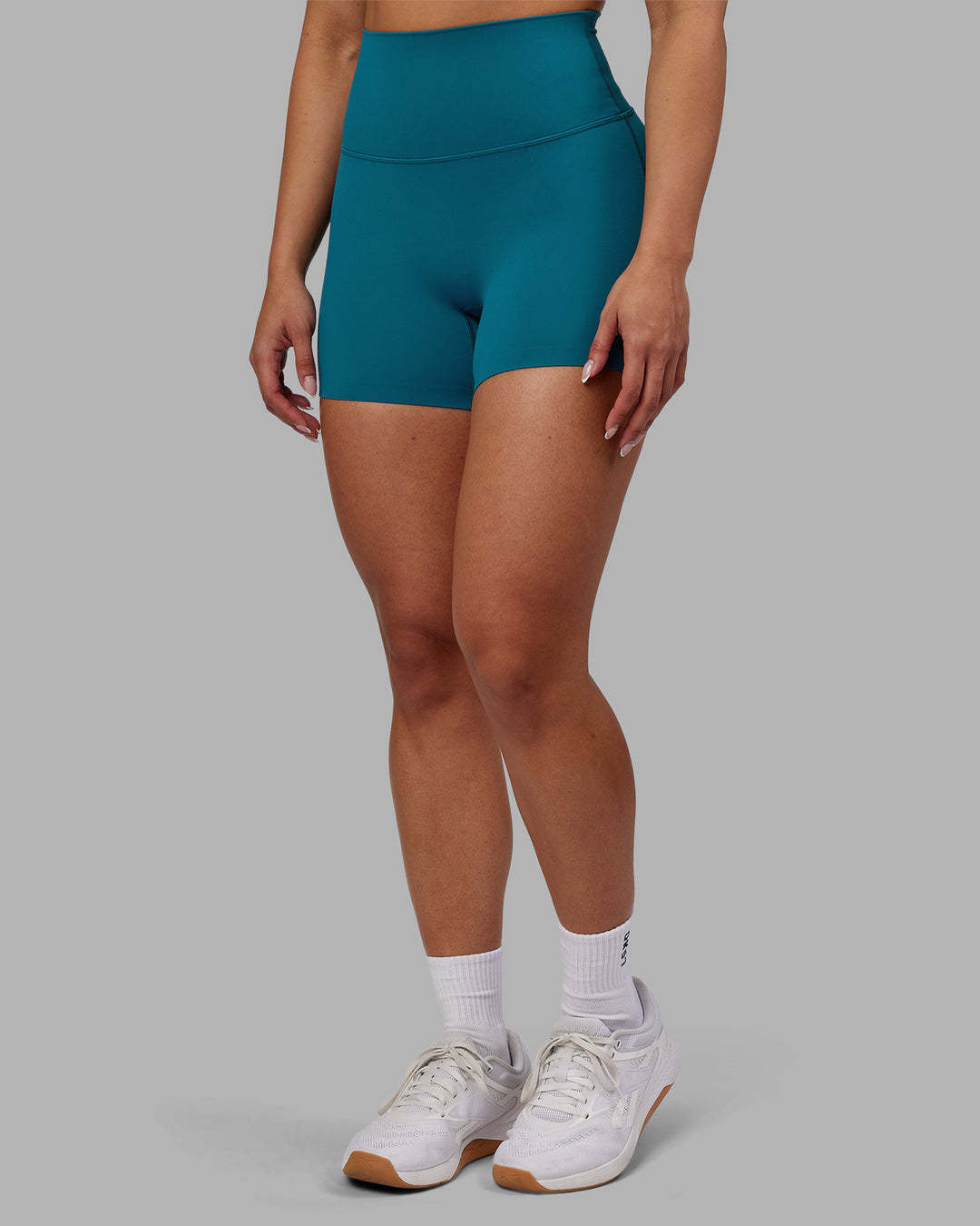 Woman wearing Elixir Ultra High-Rise 4&quot; Short - Blue Coral | Model:Ayla | Size:S