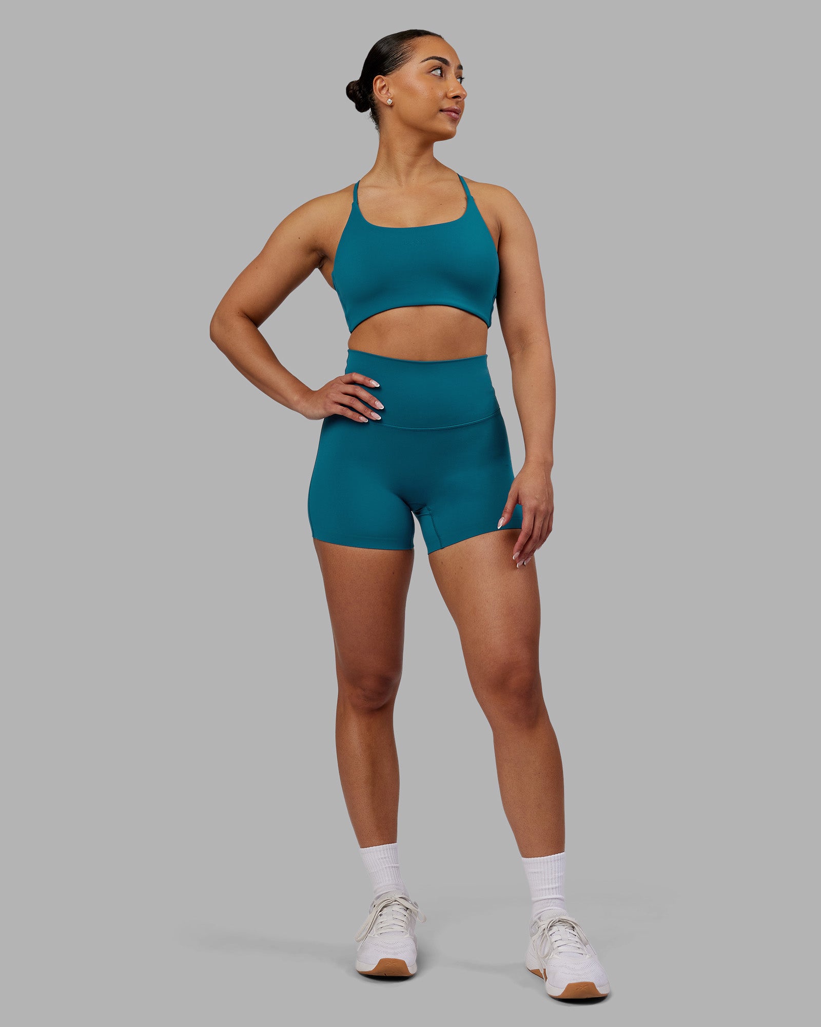 Woman wearing Elixir Ultra High-Rise 4" Short - Blue Coral | Model:Ayla | Size:S