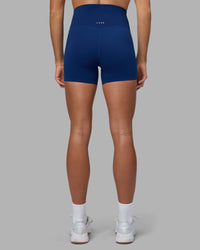 Woman wearing Elixir Ultra High-Rise 4" Short - Midnight Blue | Model:Katie | Size:S