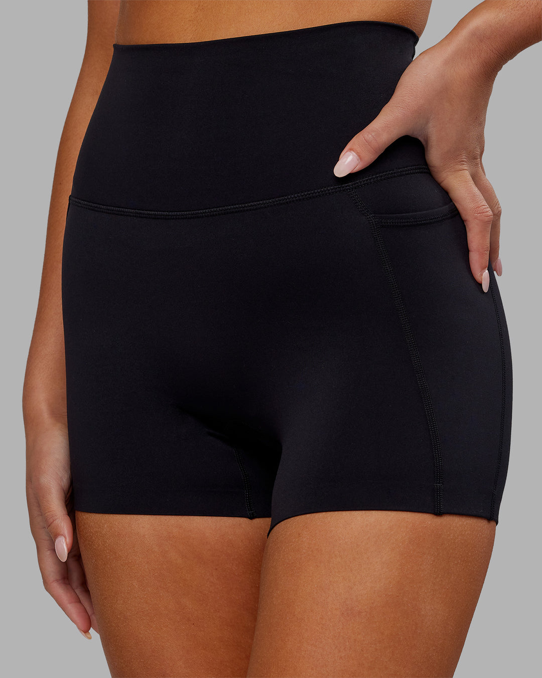 Woman wearing Elixir Ultra High-Rise 4&quot; Short Pockets - Black | Model:Kirstyn | Size:S