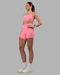 Woman wearing Elixir Ultra High-Rise 4" Short Pockets - Candy Pink | Model:Phoebe | Size:S
