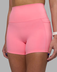 Woman wearing Elixir Ultra High-Rise 4" Short Pockets - Candy Pink | Model:Phoebe | Size:S
