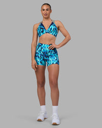 Woman wearing Elixir Ultra High-Rise 4" Short Pockets - Luminous | Model:Sophie | Size:S