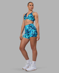 Woman wearing Elixir Ultra High-Rise 4" Short Pockets - Luminous | Model:Sophie | Size:S