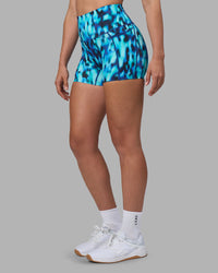 Woman wearing Elixir Ultra High-Rise 4" Short Pockets - Luminous | Model:Sophie | Size:S