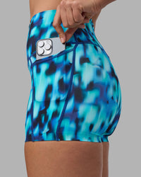 Woman wearing Elixir Ultra High-Rise 4" Short Pockets - Luminous | Model:Sophie | Size:S