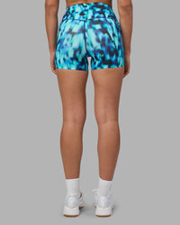 Woman wearing Elixir Ultra High-Rise 4" Short Pockets - Luminous | Model:Sophie | Size:S