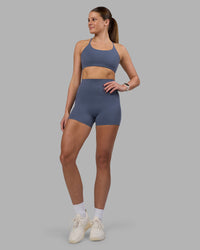 Woman wearing Elixir Ultra High-Rise 4" Short Pockets - Night Shadow | Model:Phoebe | Size:S