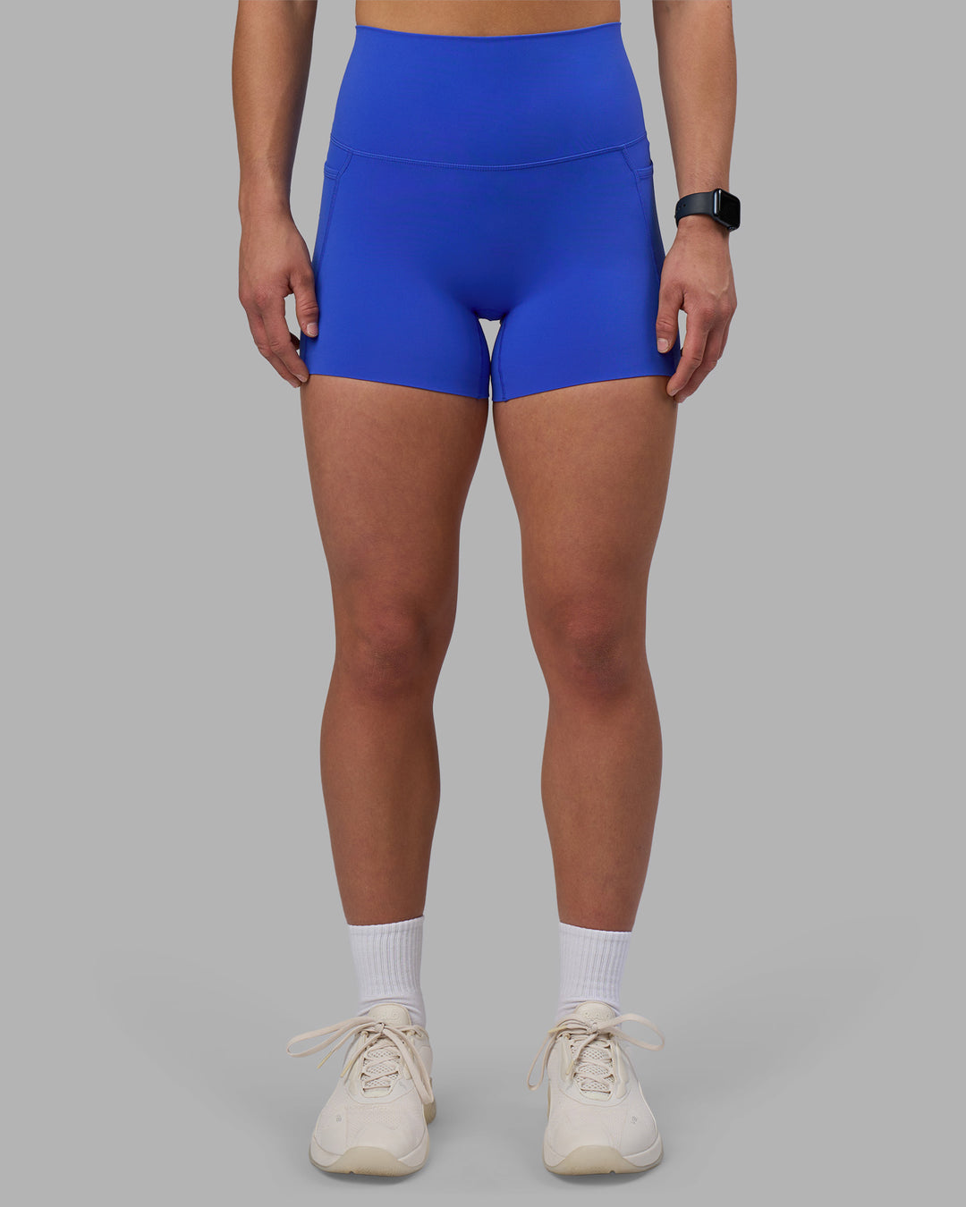 Woman wearing Elixir Ultra High-Rise 4&quot; Short Pockets - Power Cobalt | Model:Keisha | Size:S