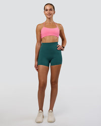 Woman wearing Elixir Ultra High-Rise 4" Short Pockets - Transformative Teal | Model:Myrte | Size:S
