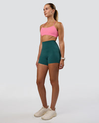 Woman wearing Elixir Ultra High-Rise 4" Short Pockets - Transformative Teal | Model:Myrte | Size:S