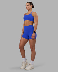 Woman wearing Elixir Ultra High-Rise 4" Short - Power Cobalt | Model:Keisha | Size:S