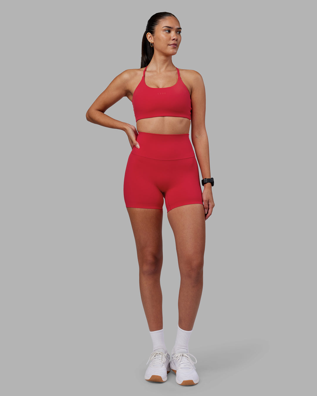 Woman wearing Elixir Ultra High-Rise 4" Short - Scarlet | Model:Rhiley | Size:S
