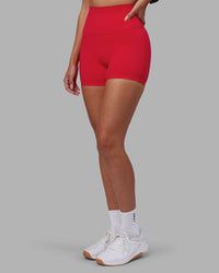 Woman wearing Elixir Ultra High-Rise 4" Short - Scarlet | Model:Rhiley | Size:S