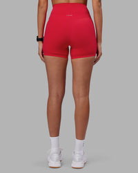 Woman wearing Elixir Ultra High-Rise 4" Short - Scarlet | Model:Rhiley | Size:S