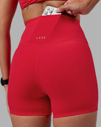 Woman wearing Elixir Ultra High-Rise 4" Short - Scarlet | Model:Rhiley | Size:S