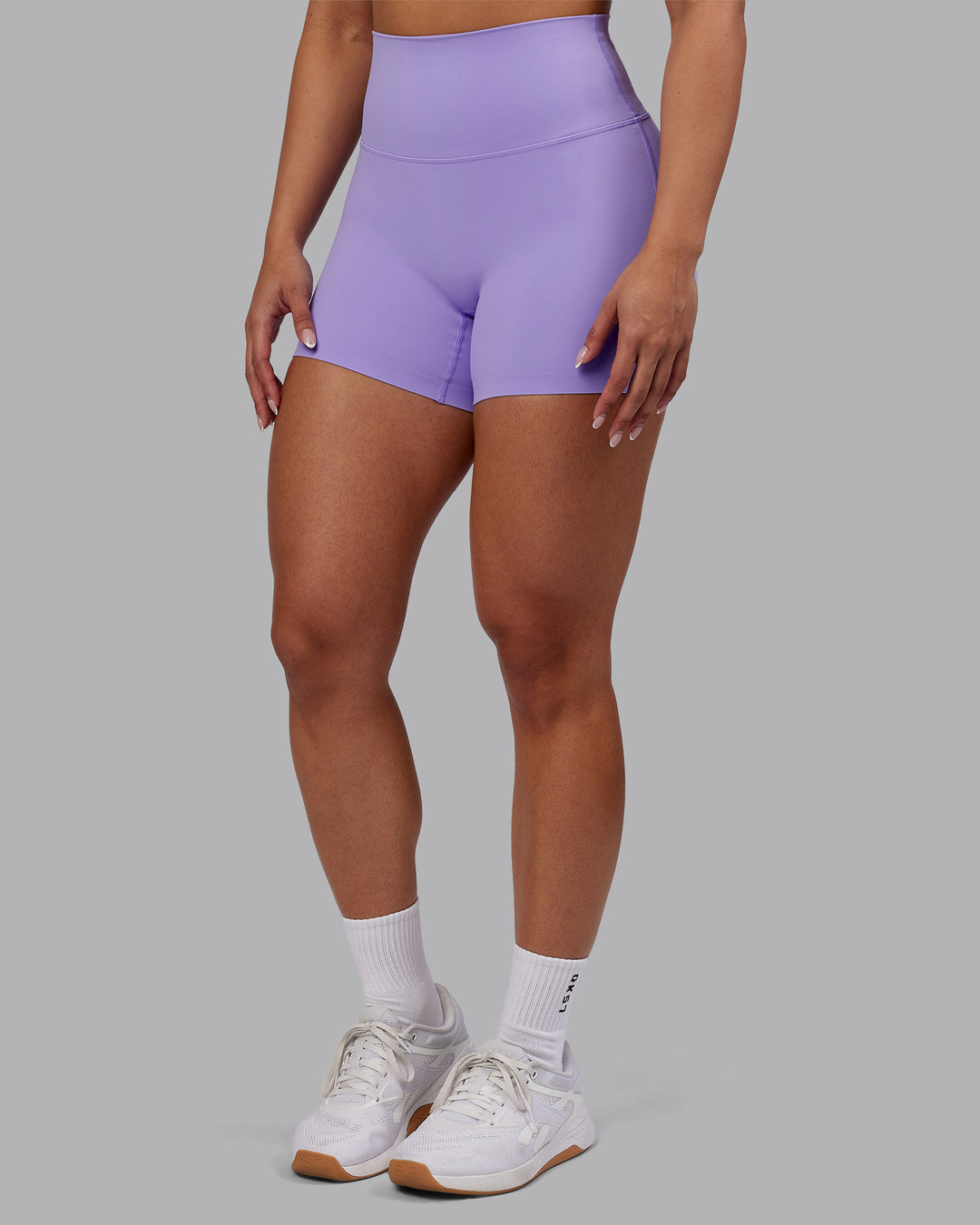Woman wearing Elixir Ultra High-Rise 4&quot; Short - Violet Ray | Model:Ayla | Size:S