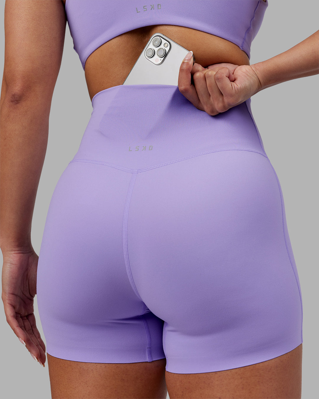 Woman wearing Elixir Ultra High-Rise 4&quot; Short - Violet Ray | Model:Ayla | Size:S