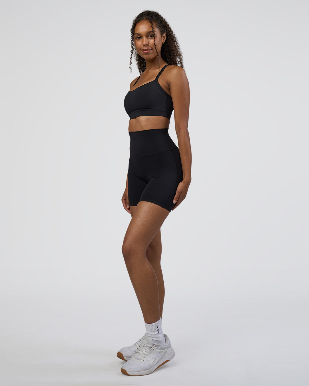 Woman wearing Elixir Ultra High-Rise 6&quot; Short - Black | Model:Jordan | Size:S