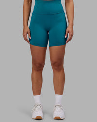 Woman wearing Elixir Ultra High-Rise 6" Short - Blue Coral | Model:Ayla | Size:S