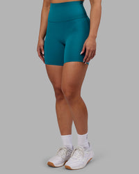 Woman wearing Elixir Ultra High-Rise 6" Short - Blue Coral | Model:Ayla | Size:S