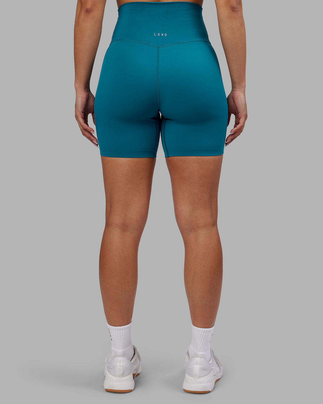 Woman wearing Elixir Ultra High-Rise 6&quot; Short - Blue Coral | Model:Ayla | Size:S