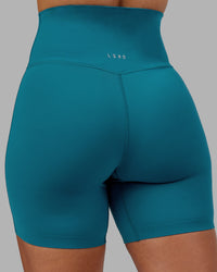  Woman wearing Elixir Ultra High-Rise 6" Short - Blue Coral | Model:Ayla | Size:S