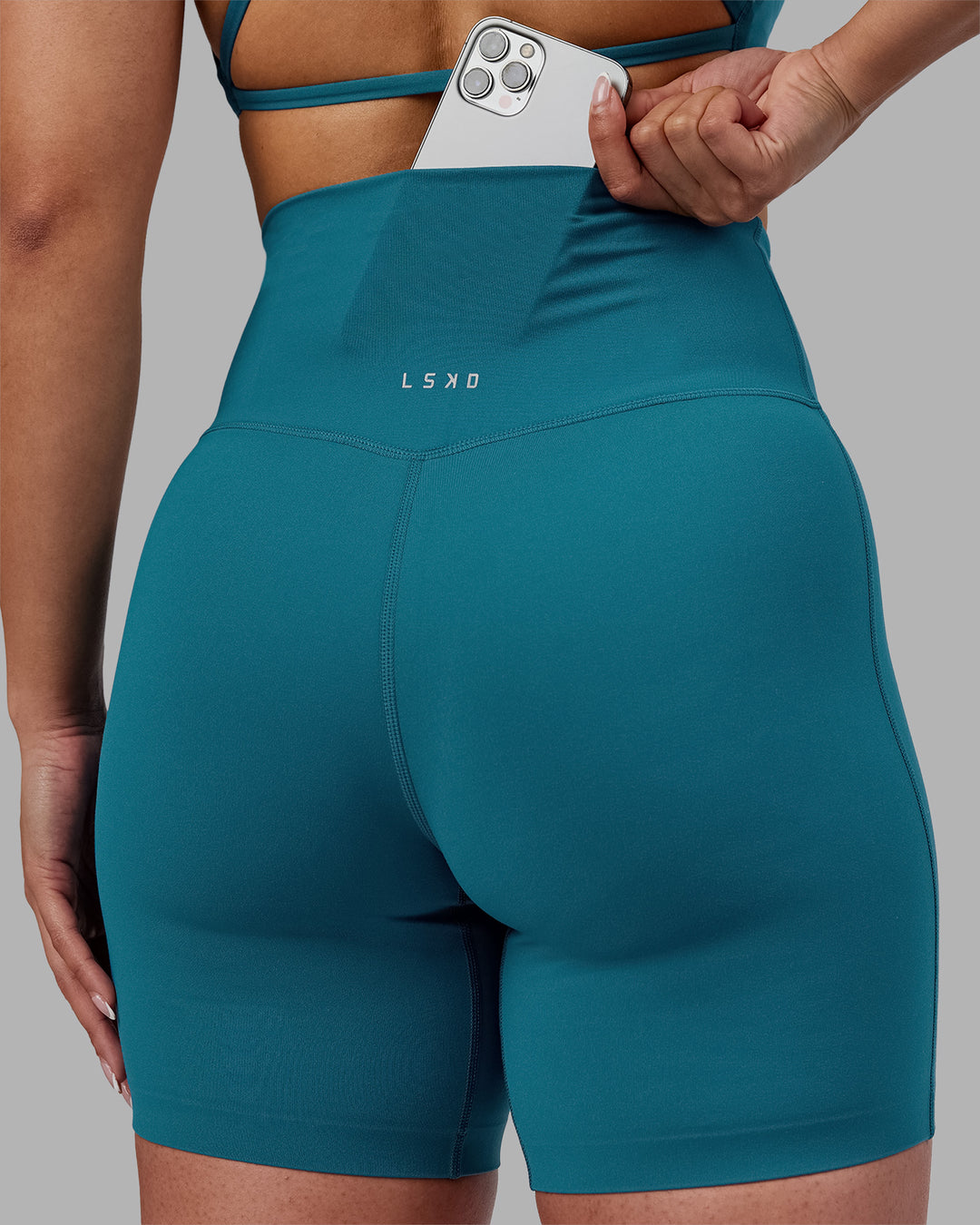 Woman wearing Elixir Ultra High-Rise 6&quot; Short - Blue Coral | Model:Ayla | Size:S