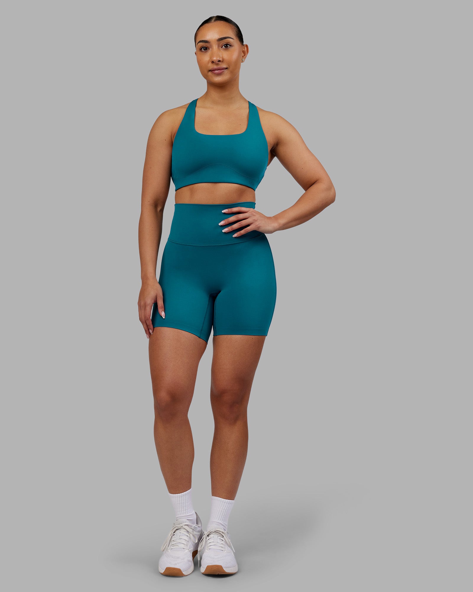 Woman wearing Elixir Ultra High-Rise 6" Short - Blue Coral | Model:Ayla | Size:S